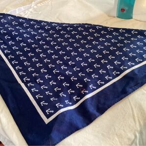 Mixture of scarfs  , some navy and white some red and one hanky .